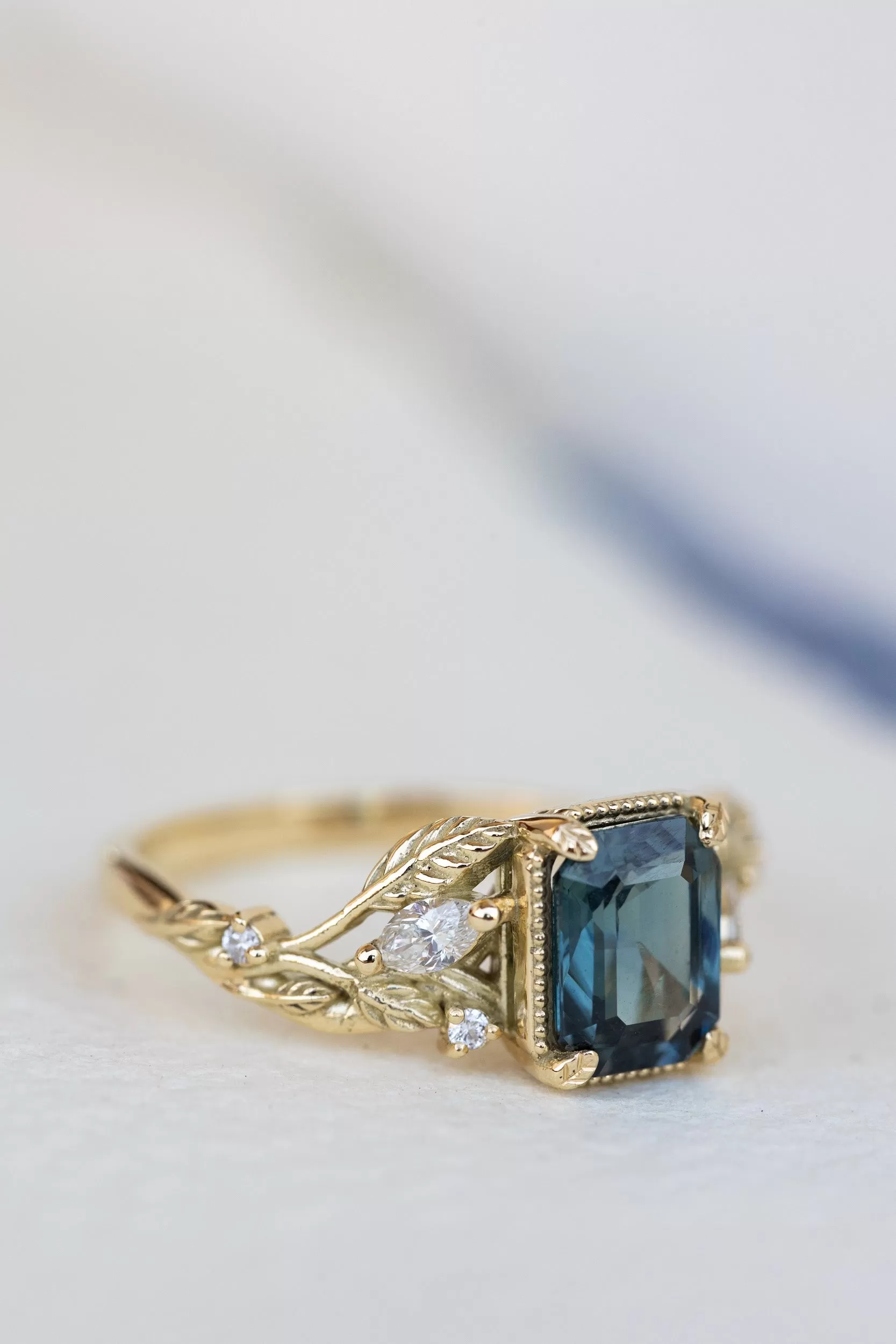 Emerald cut teal sapphire engagement ring, proposal ring with leaves and diamonds / Patricia