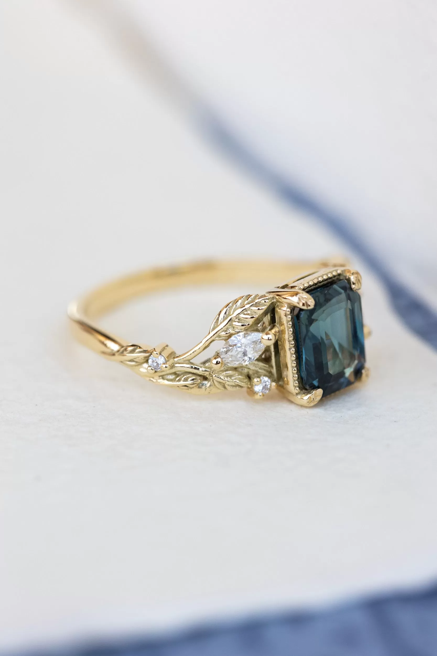 Emerald cut teal sapphire engagement ring, proposal ring with leaves and diamonds / Patricia