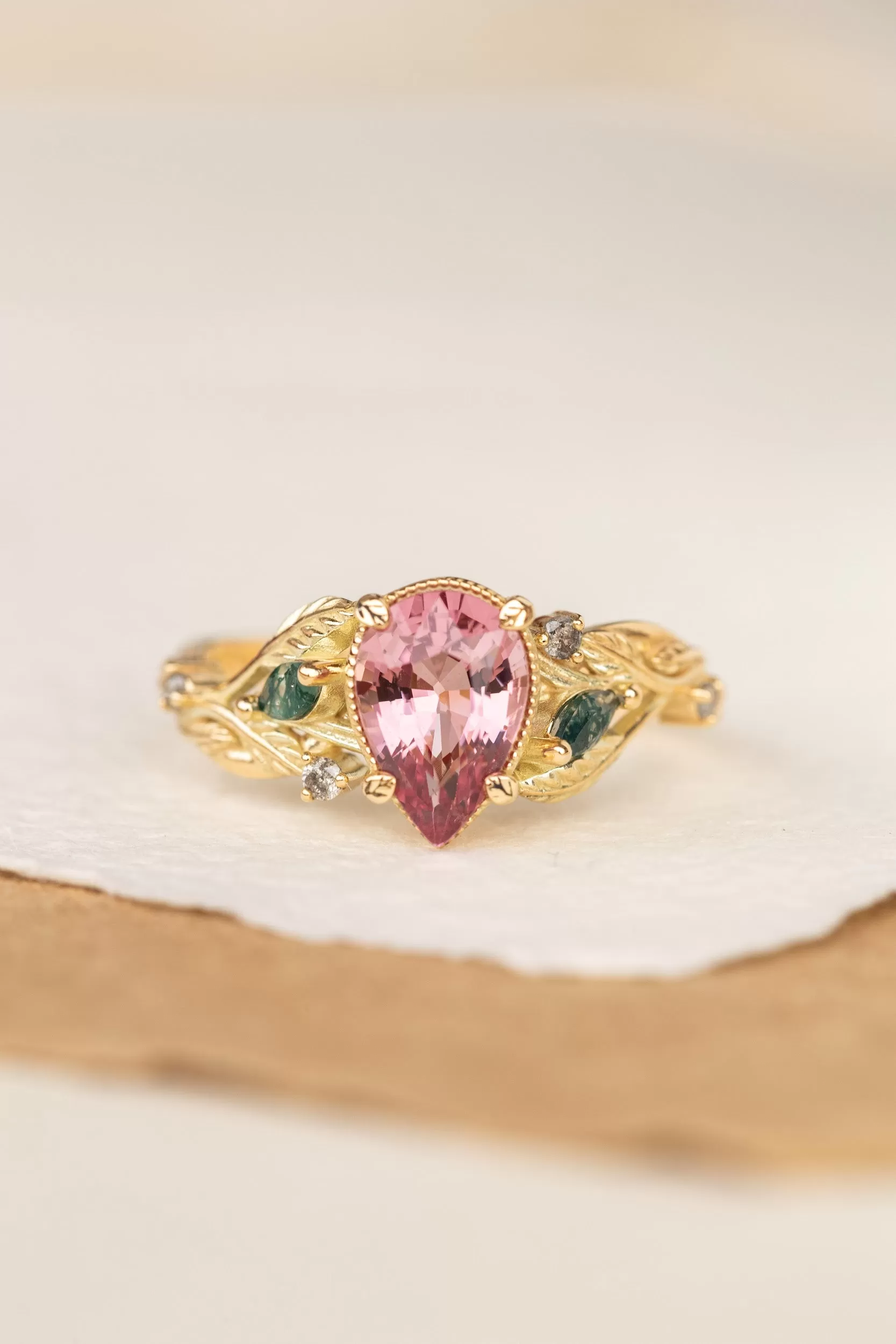 Pink spinel nature themed engagement ring with moss agates and salt and pepper diamonds / Patricia